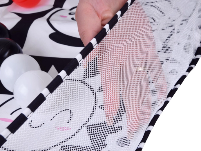 Playpen with mesh sides and a set of balls