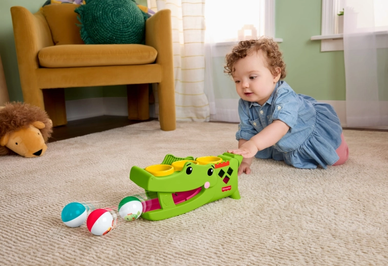 Balls roll away and encourage crawling