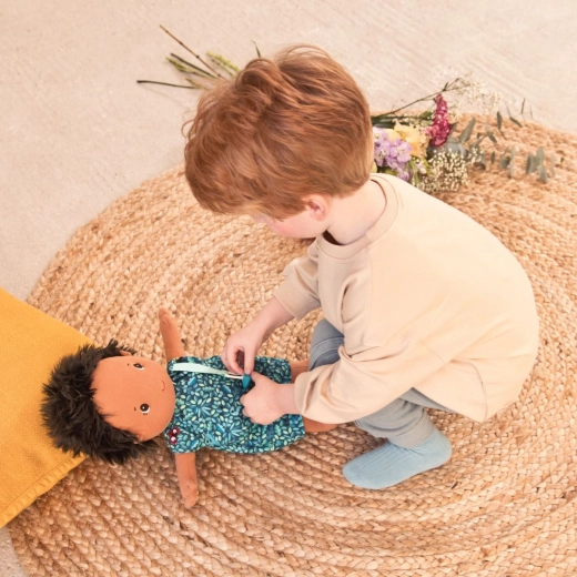 Playing at caring for a baby