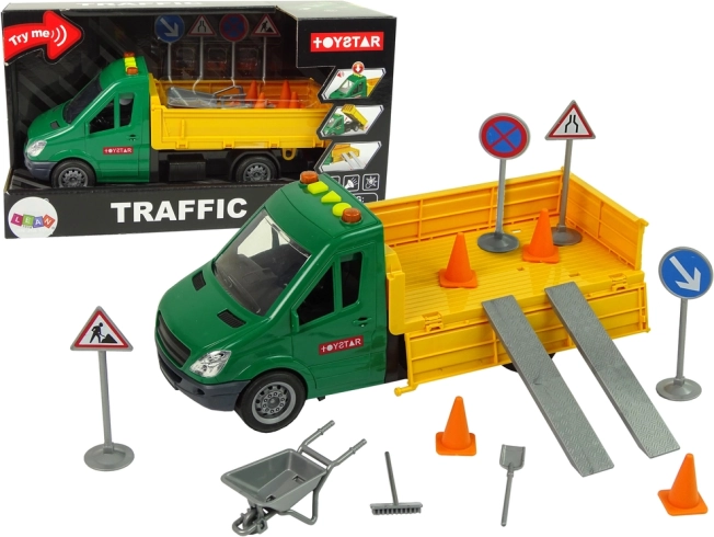 Road tipper truck with friction drive and traffic accessories