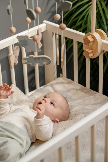 Suitable above a crib and a changing table