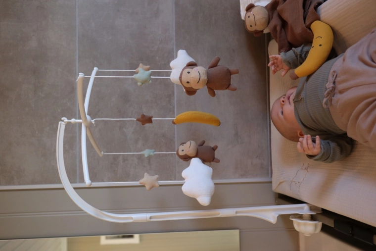 Cute soft figures above the crib