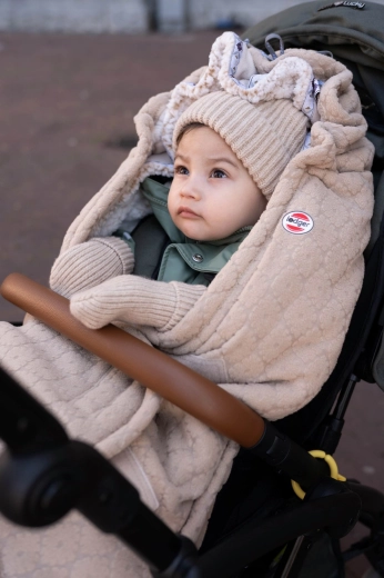Stylish pom-pom and fold-over brim