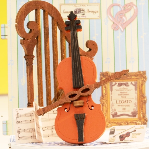 Detailed elements including a mini violin
