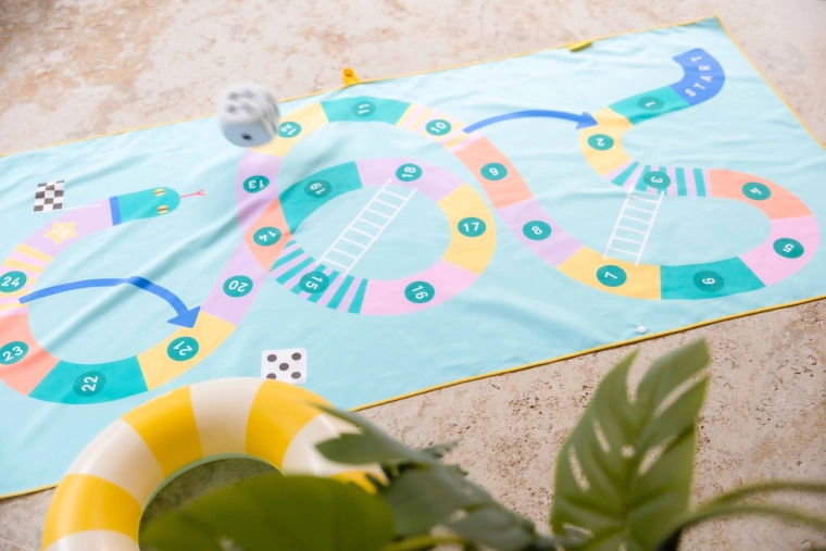Snakes and Ladders game right on the towel