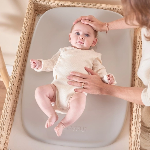Ergonomic shape for safer diaper changes