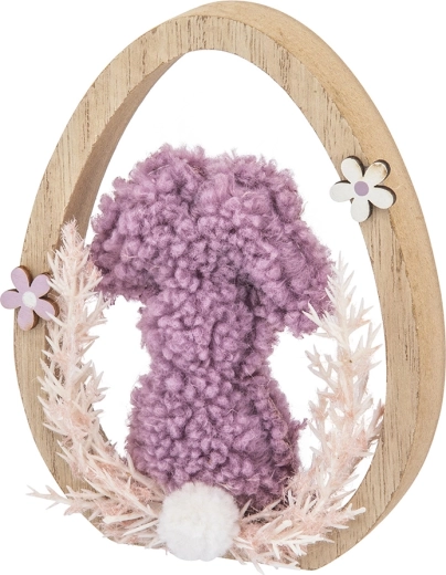 Delicate Easter motif in a wooden egg