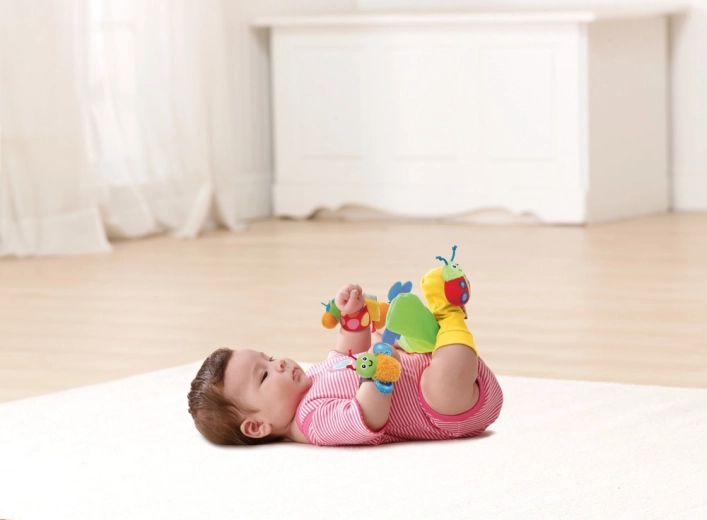 Feet in motion: rattles sewn onto socks