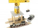 Wooden crane at dock with ships and cars